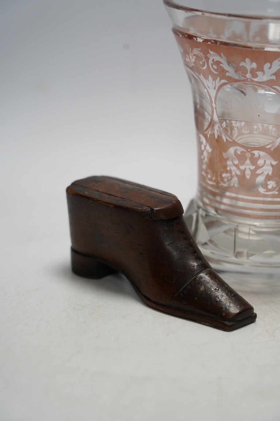 Sundry items comprising a Victorian flashed cut and engraved beaker, a 19th century model of a sphinx, and a green shoe snuff box. Condition - fair